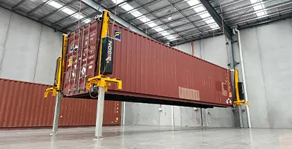 Heavy container being lifted onto a truck