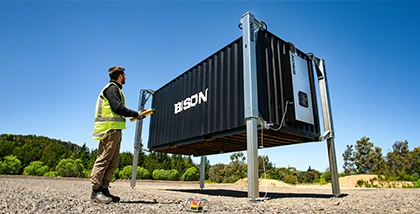 Container lifted in a field without a crane